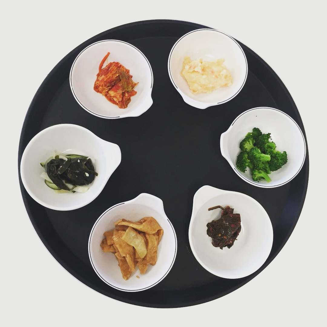 A circle of bowls filled with different types of food