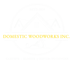 Logo for Domestic Woodworks, featuring an illustration of a house and a hand plane, with the text