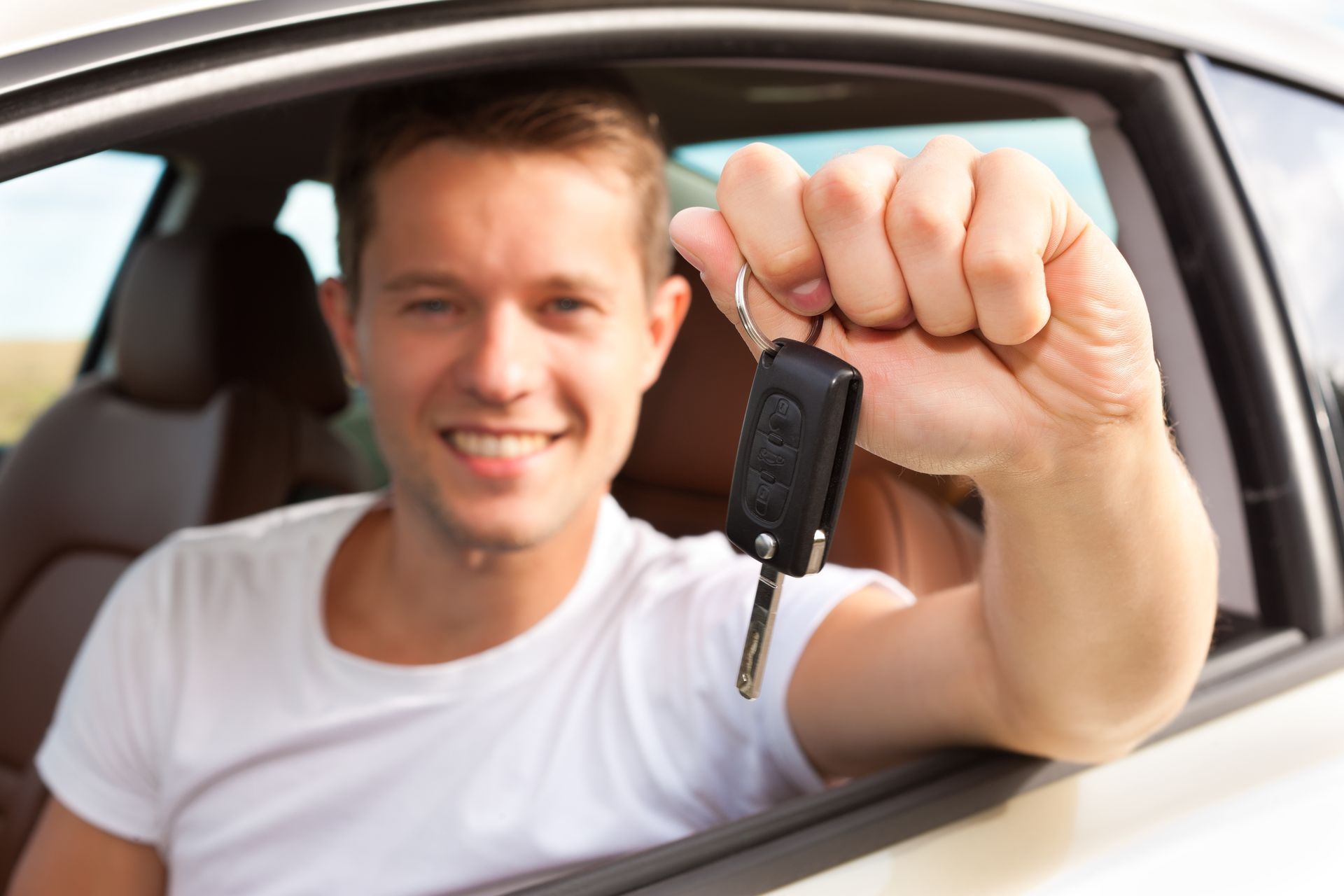 Man Holding Car Keys