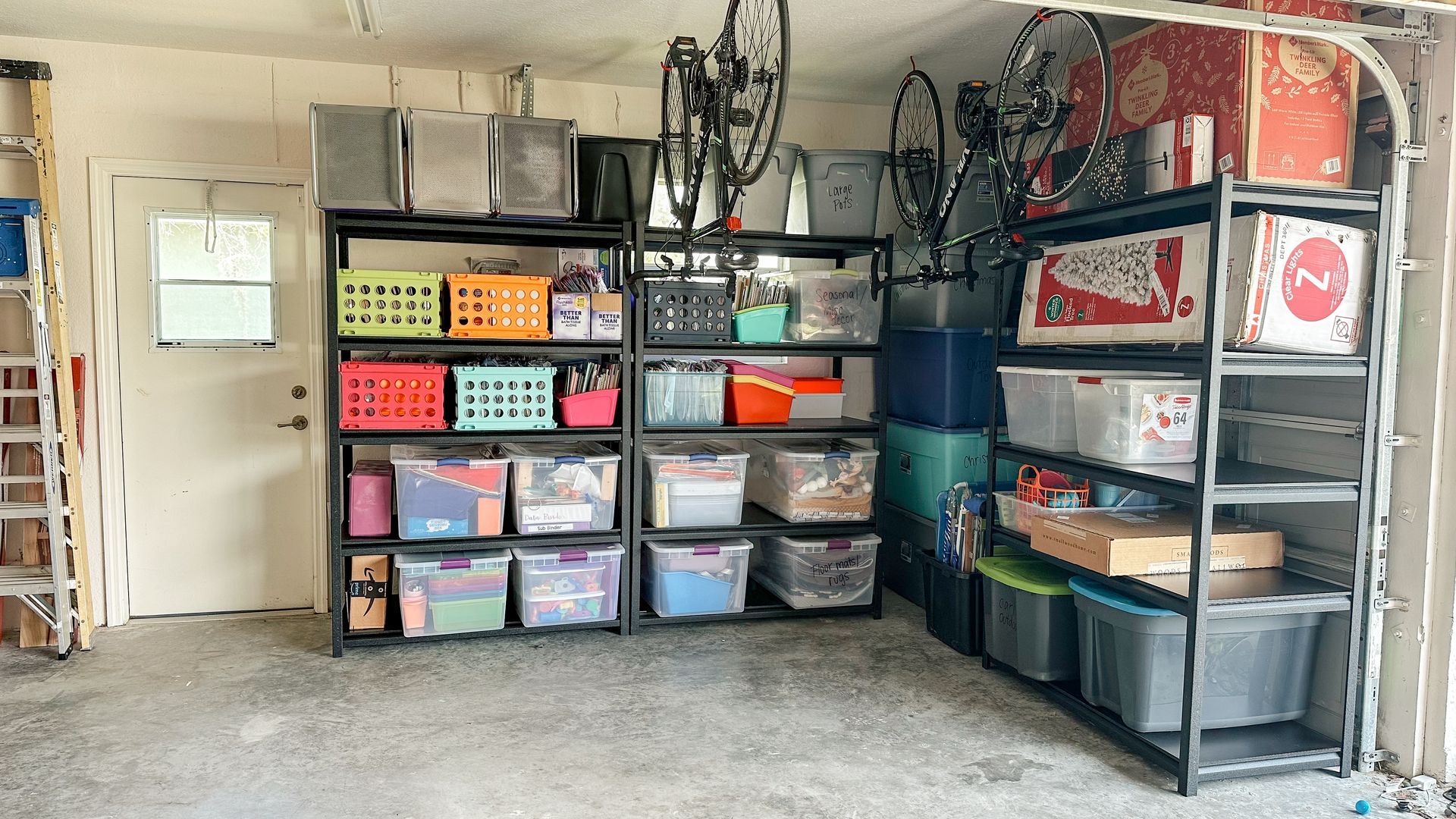 A garage filled with lots of shelves and bins.