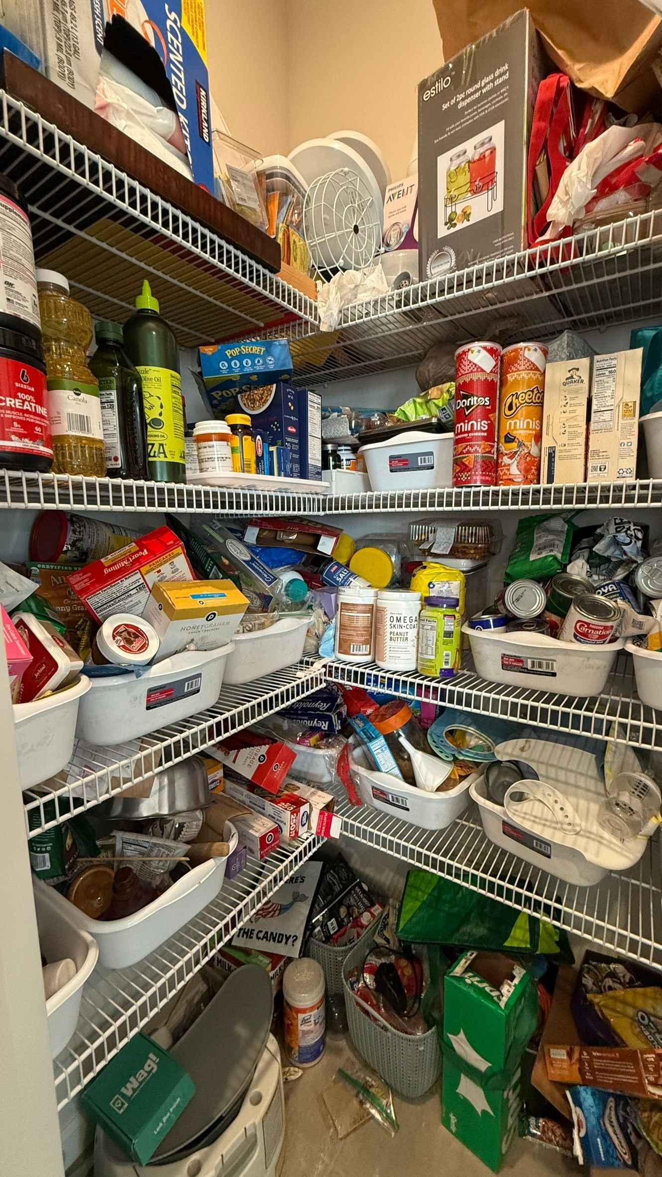 A pantry filled with lots of food and boxes.