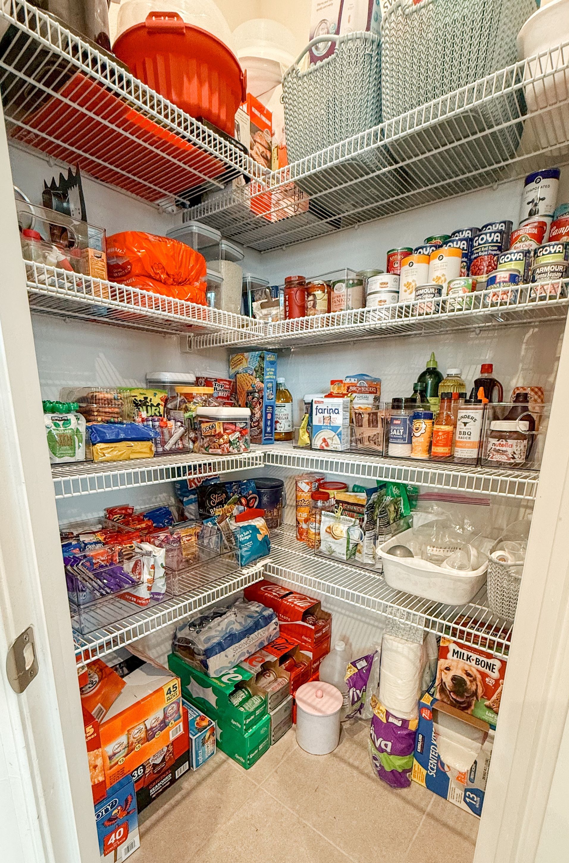 A pantry filled with lots of food and supplies.