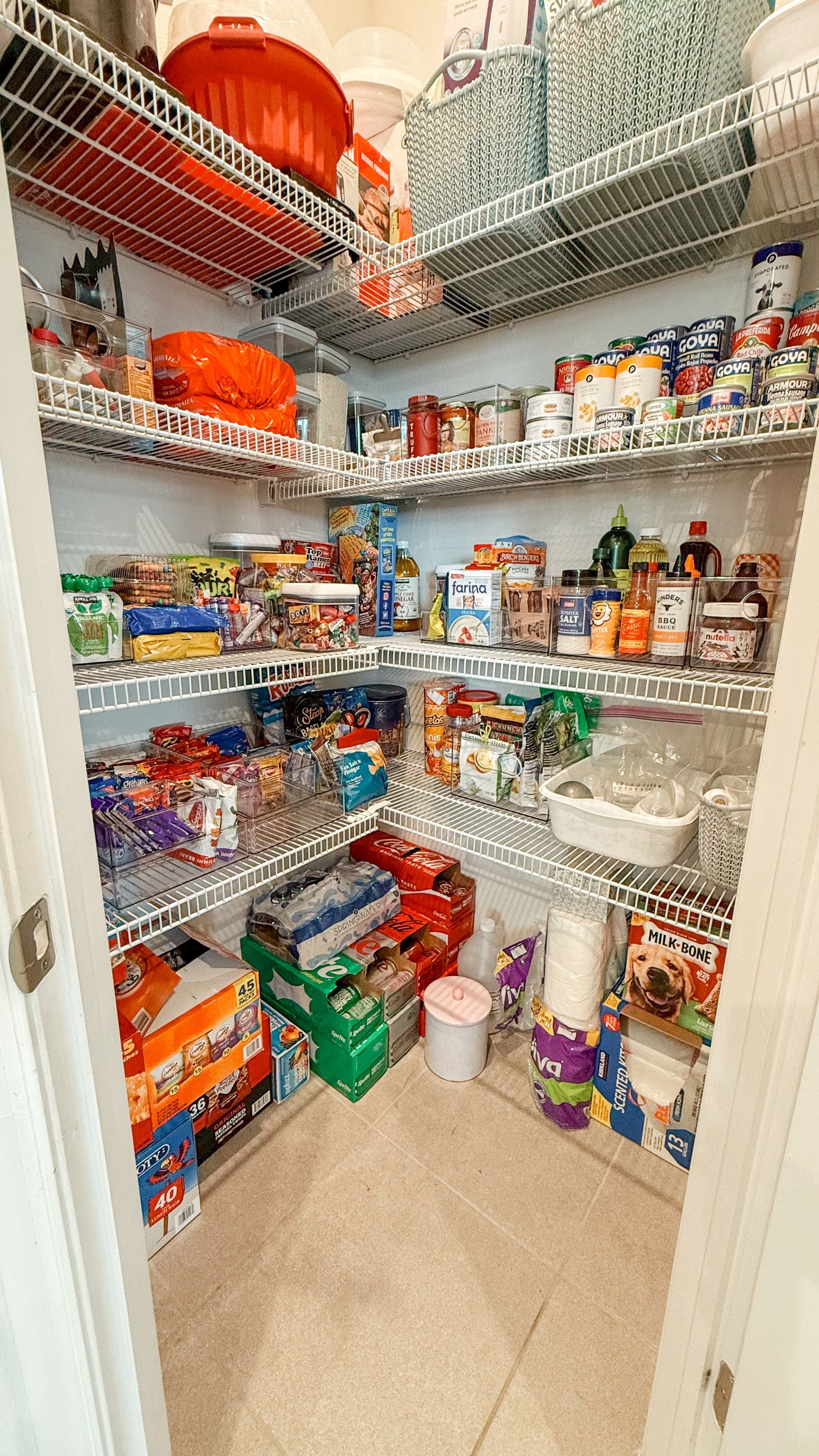 A pantry filled with lots of food and supplies.