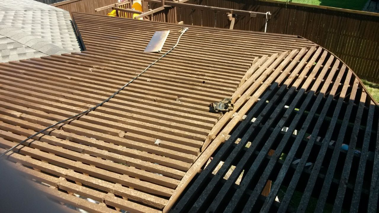 Brown wooden deck with curved edges and slatted surface.