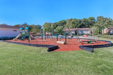 There is a playground in the middle of the park.