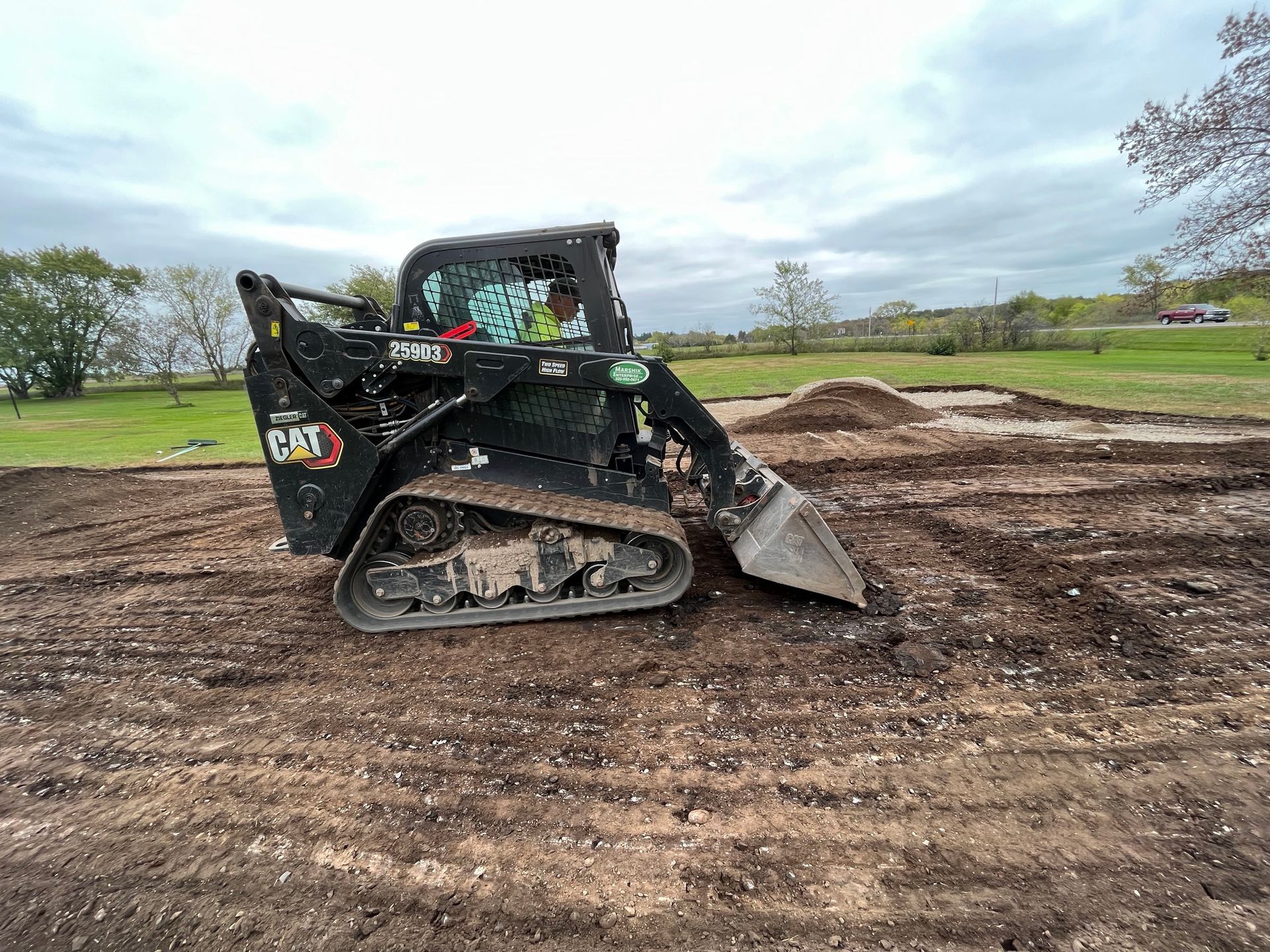 a black bulldozer on dirt