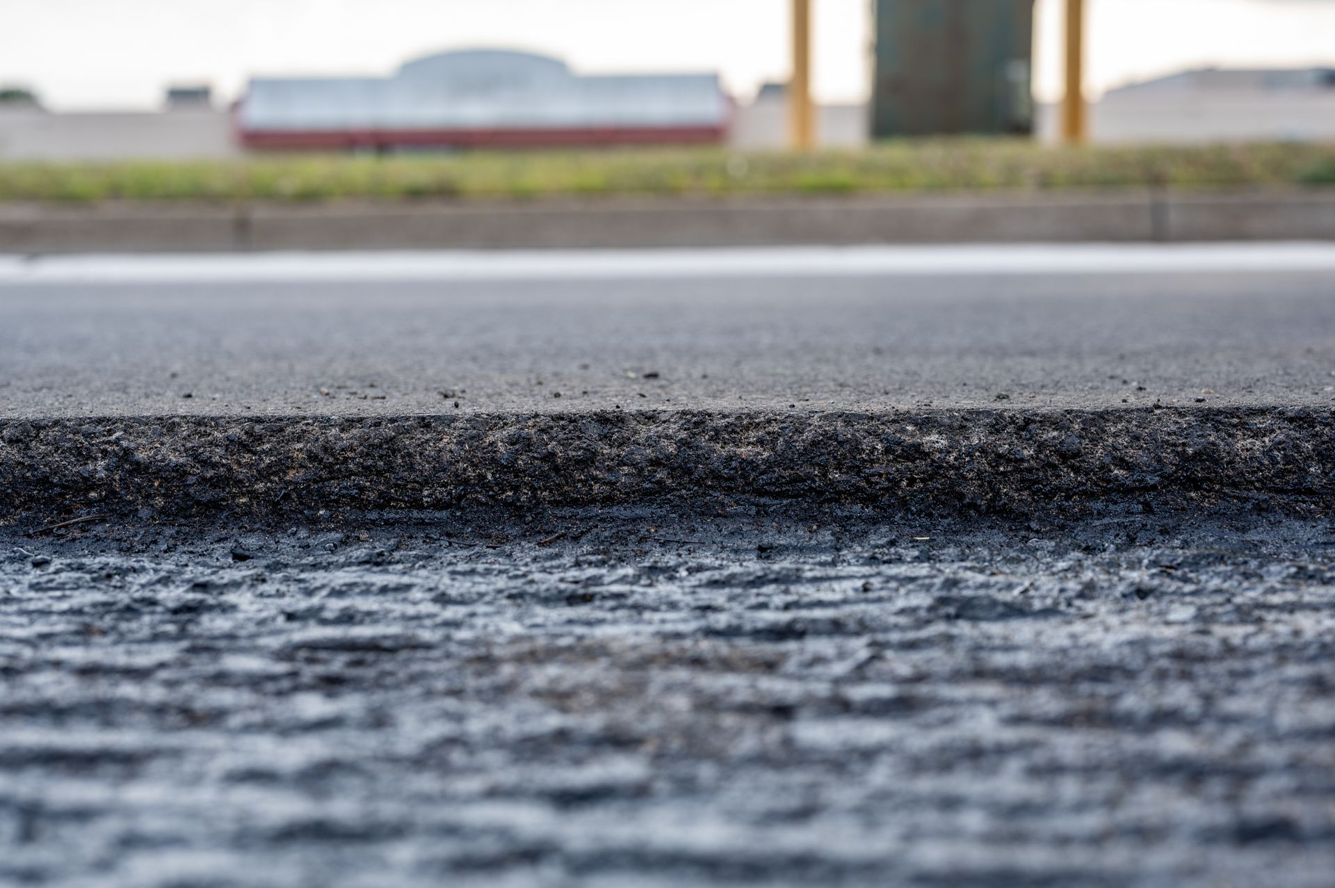 A close up of a piece of asphalt on a road.