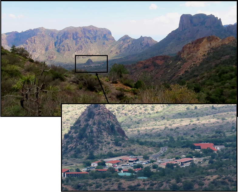 A picture of a mountain range with a small village in the foreground