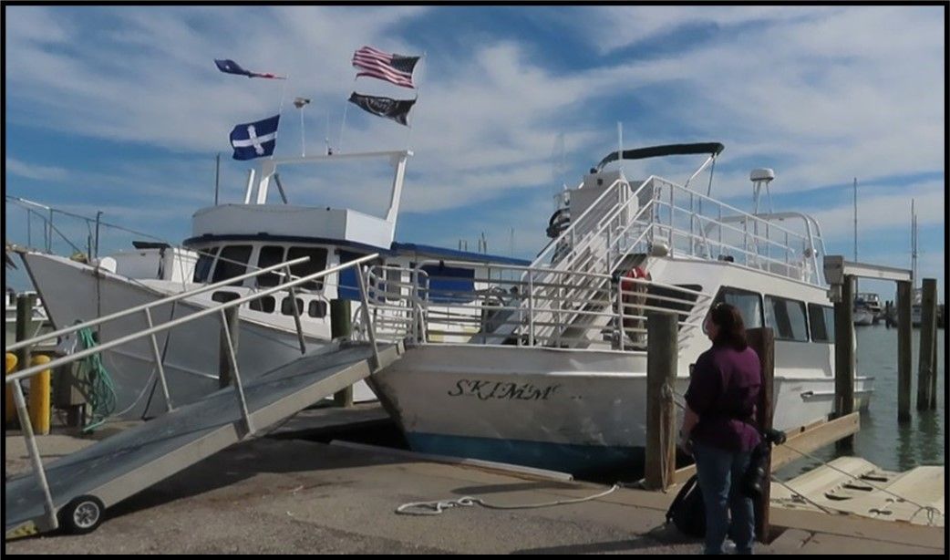 A boat with a ramp leading to it is called sponge