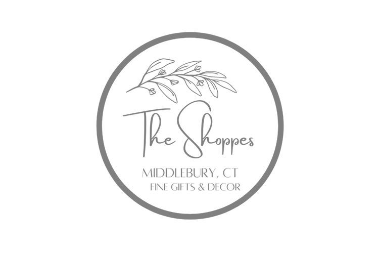 Logo for The Shoppes in Middlebury, CT; a circular frame with text and a leaf branch design.