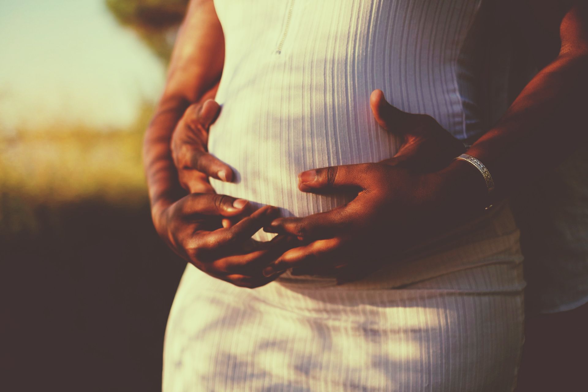 embracing a pregnant belly