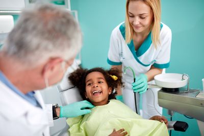 Periodontist — Dentist Checking on Kid Patient in Pittsburgh, PA