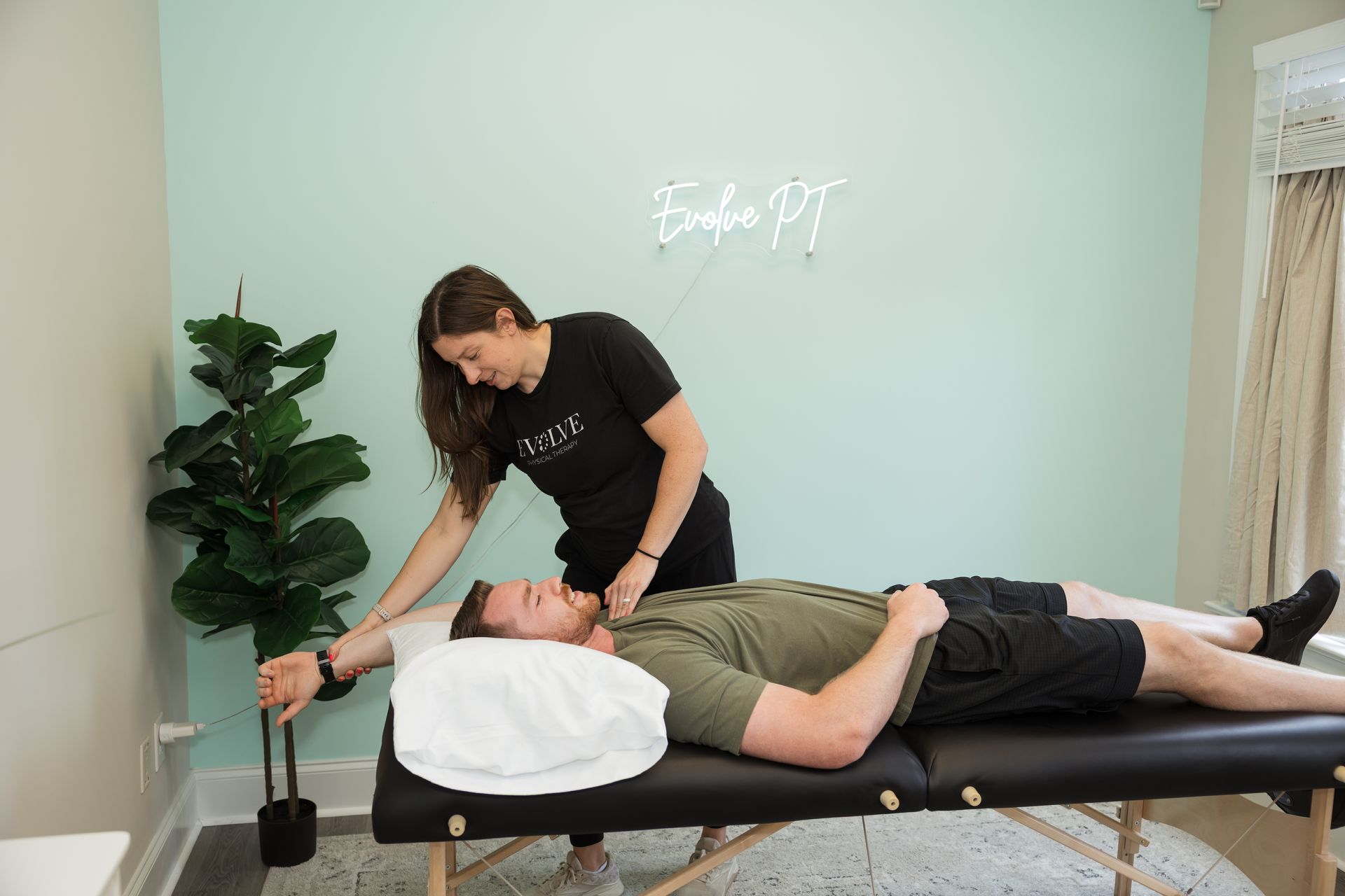 Physical Therapist performing manual therapy on shoulder