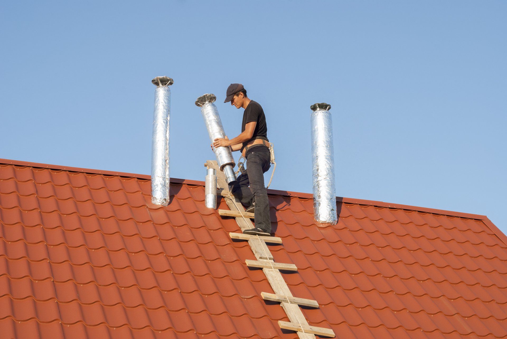 Safety Inspections — Man Inspecting A Chimney in Pittsburgh, PA