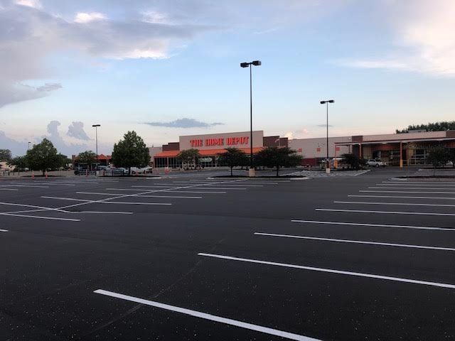 An empty parking lot in front of a home depot