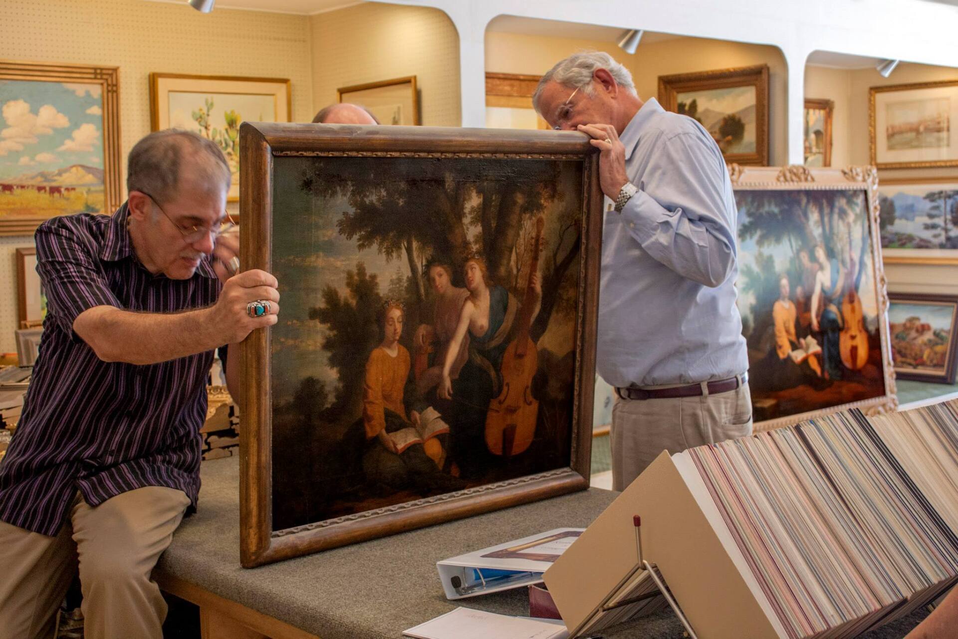 Experts Checking Artwork — Fort Worth, TX — Dow Art Galleries