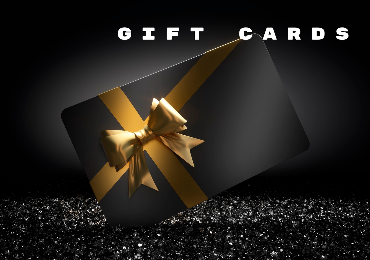 Black gift card with gold ribbon, on a bed of glitter, with 