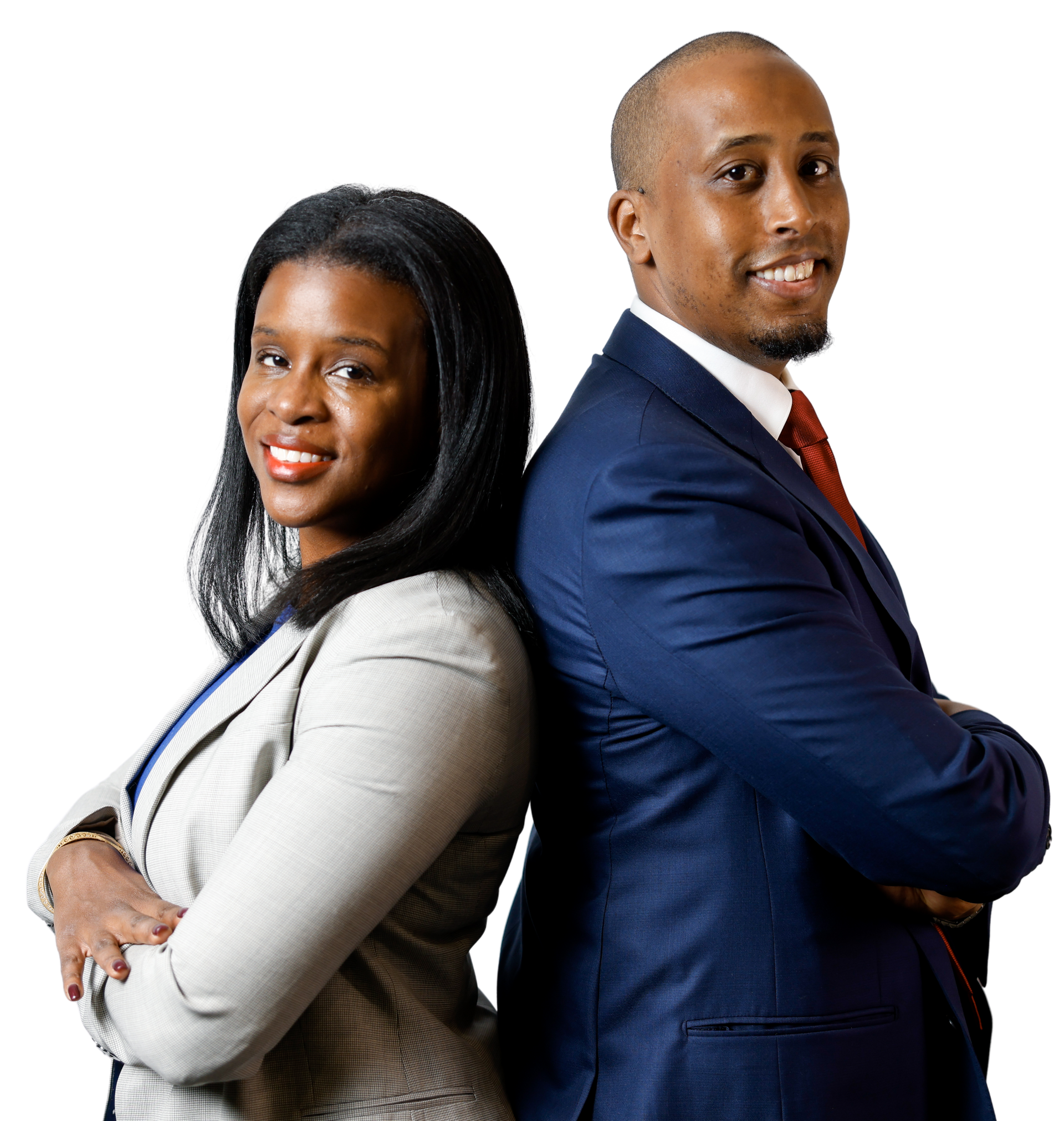 Two people in business attire standing back to back, arms crossed, smiling.