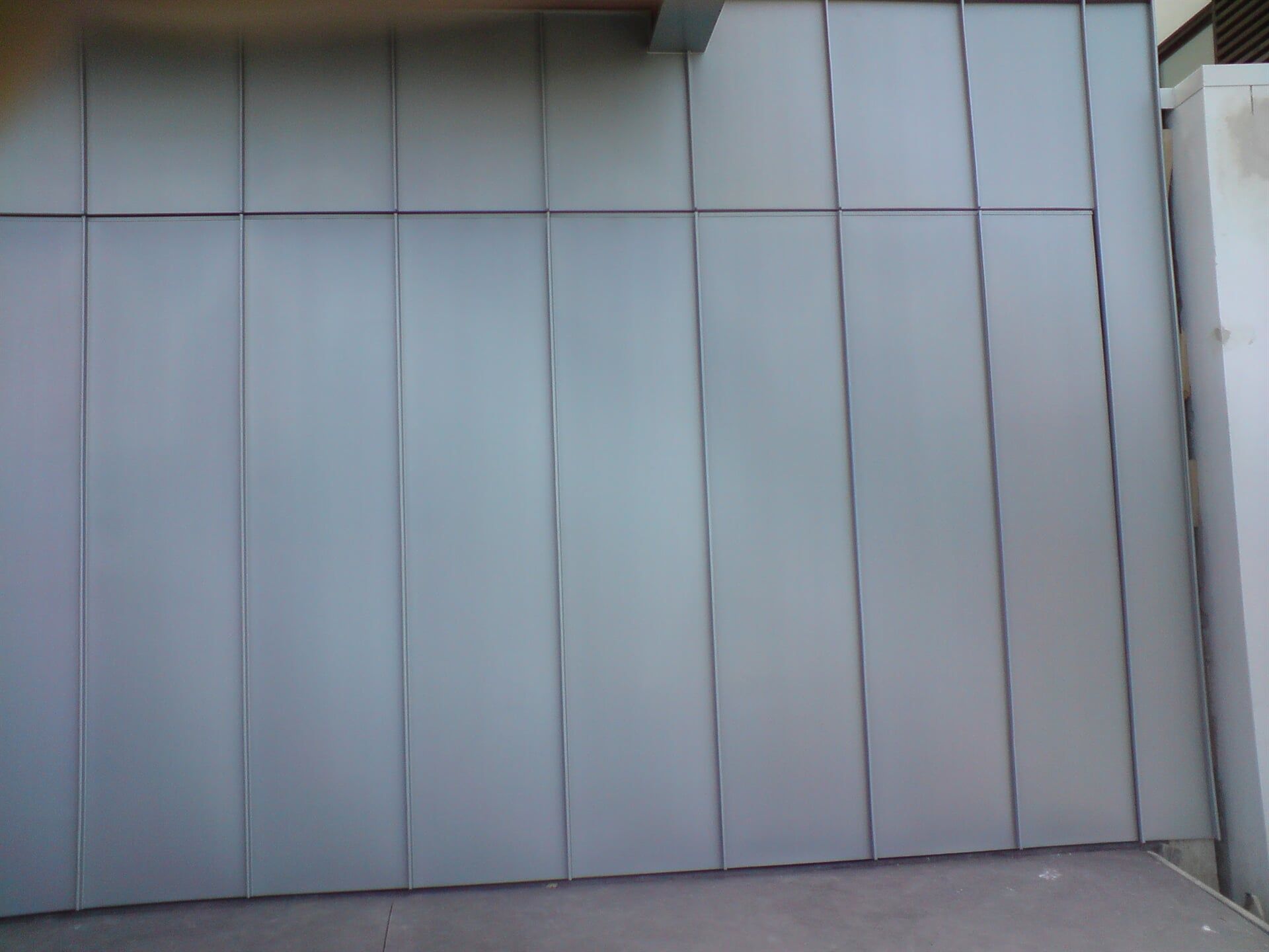 Angle Standing Seam Garage Door & Wall Cladding