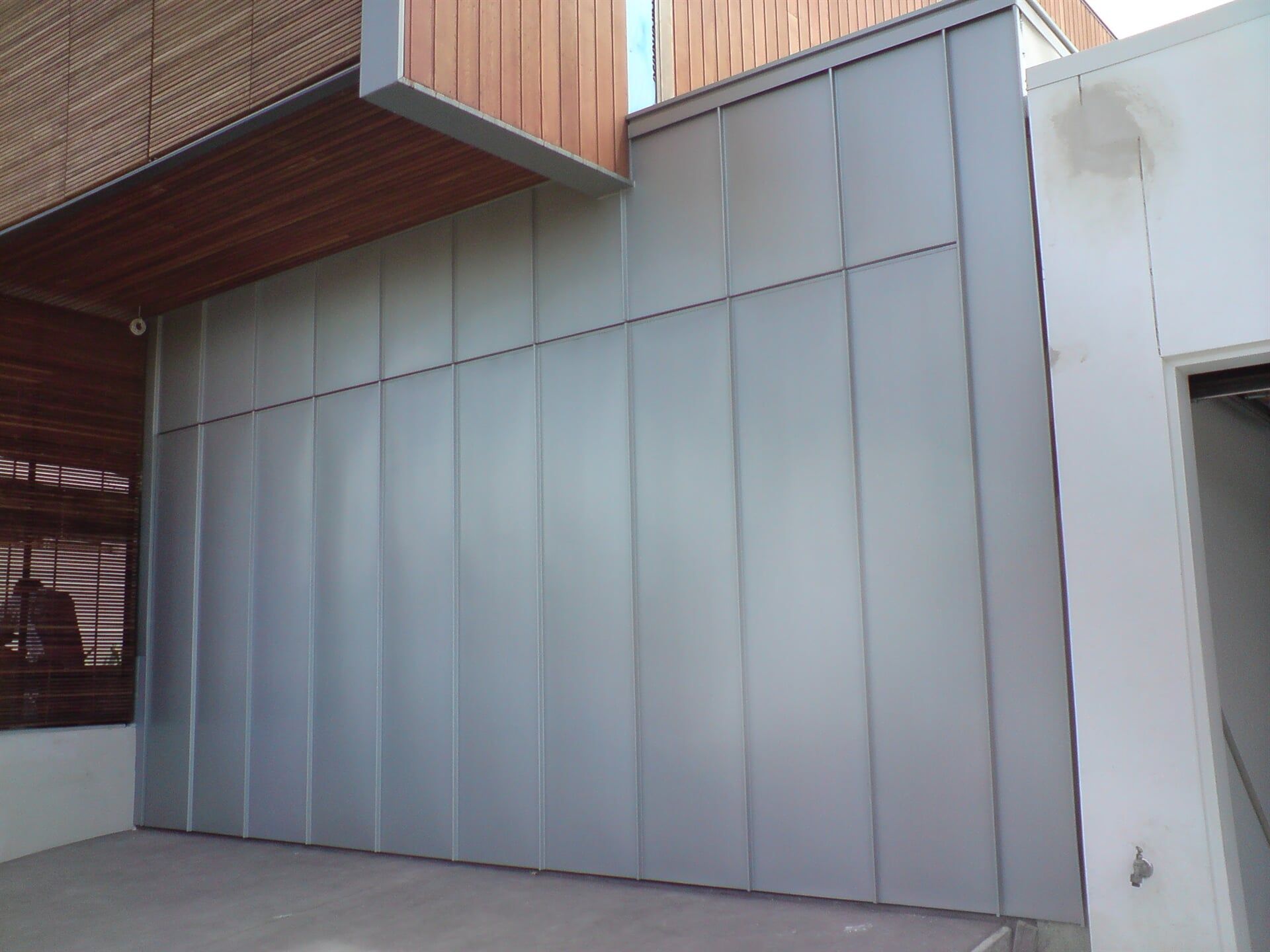 Angle Standing Seam Garage Door & Wall Cladding