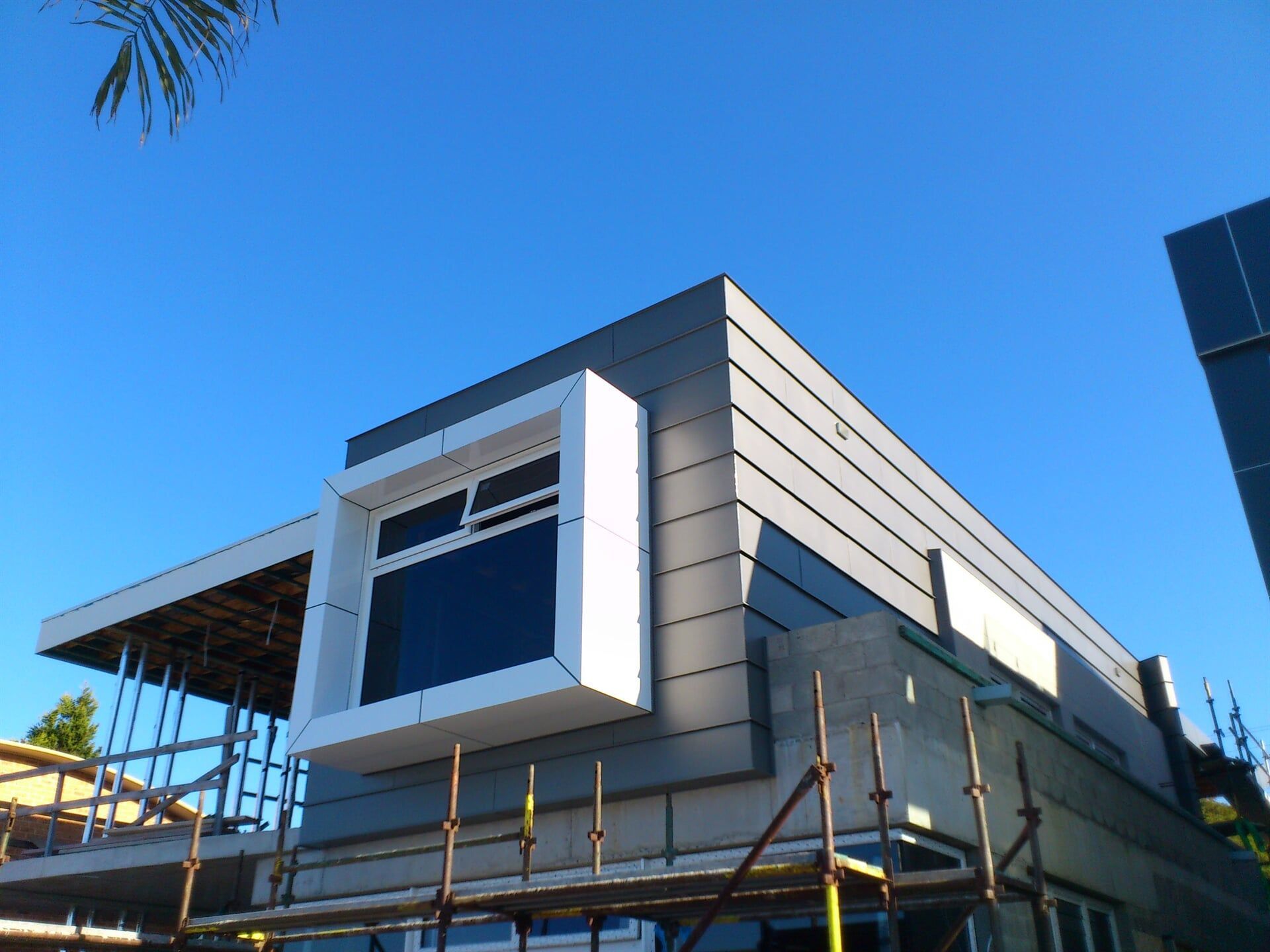 Angle Standing Seam with Cross Seams & White Composite Panels