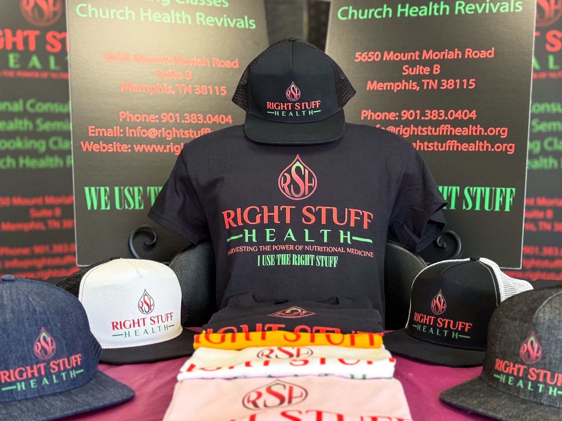 A group of right stuff health shirts and hats