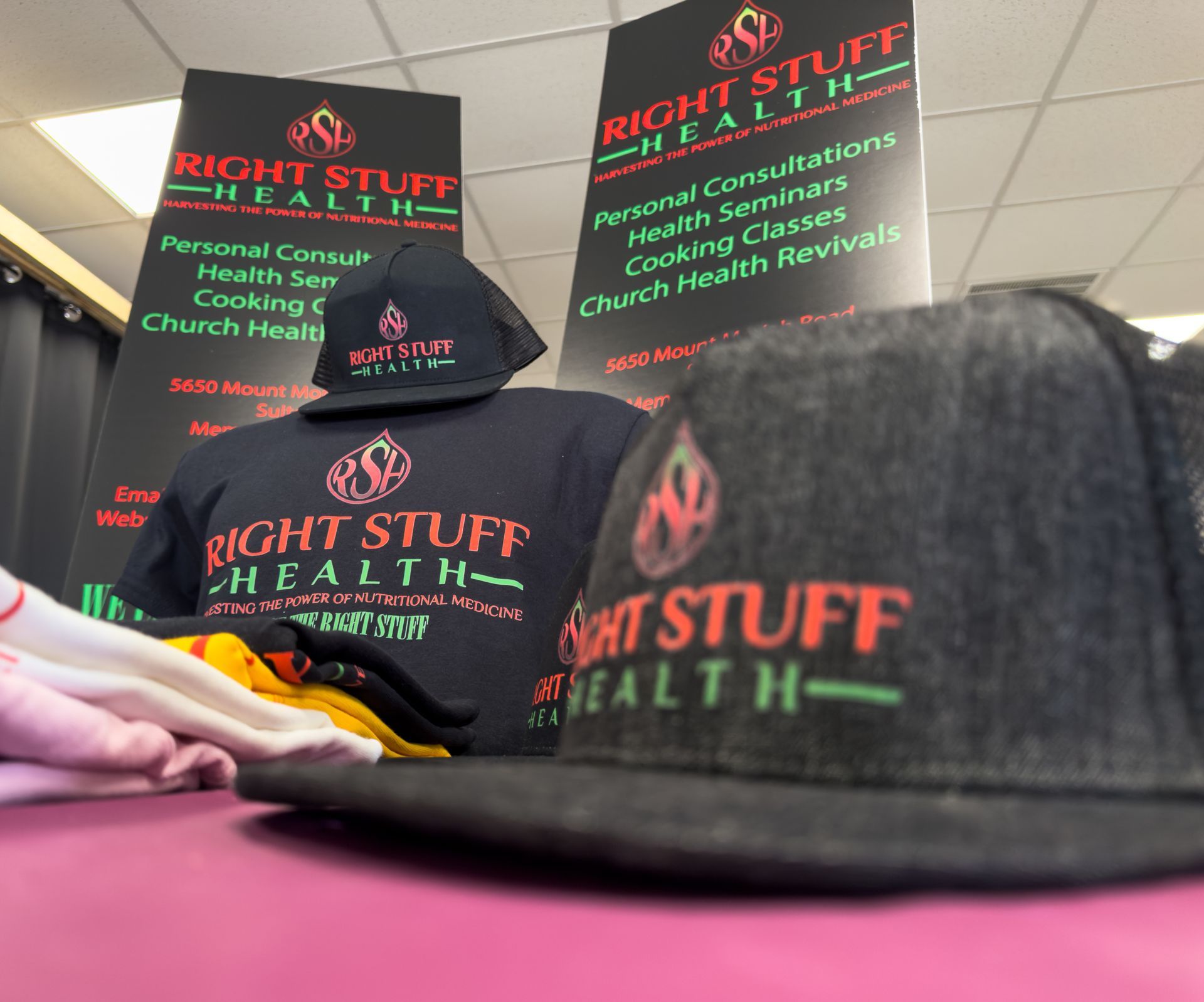 A display of right stuff health shirts and hats
