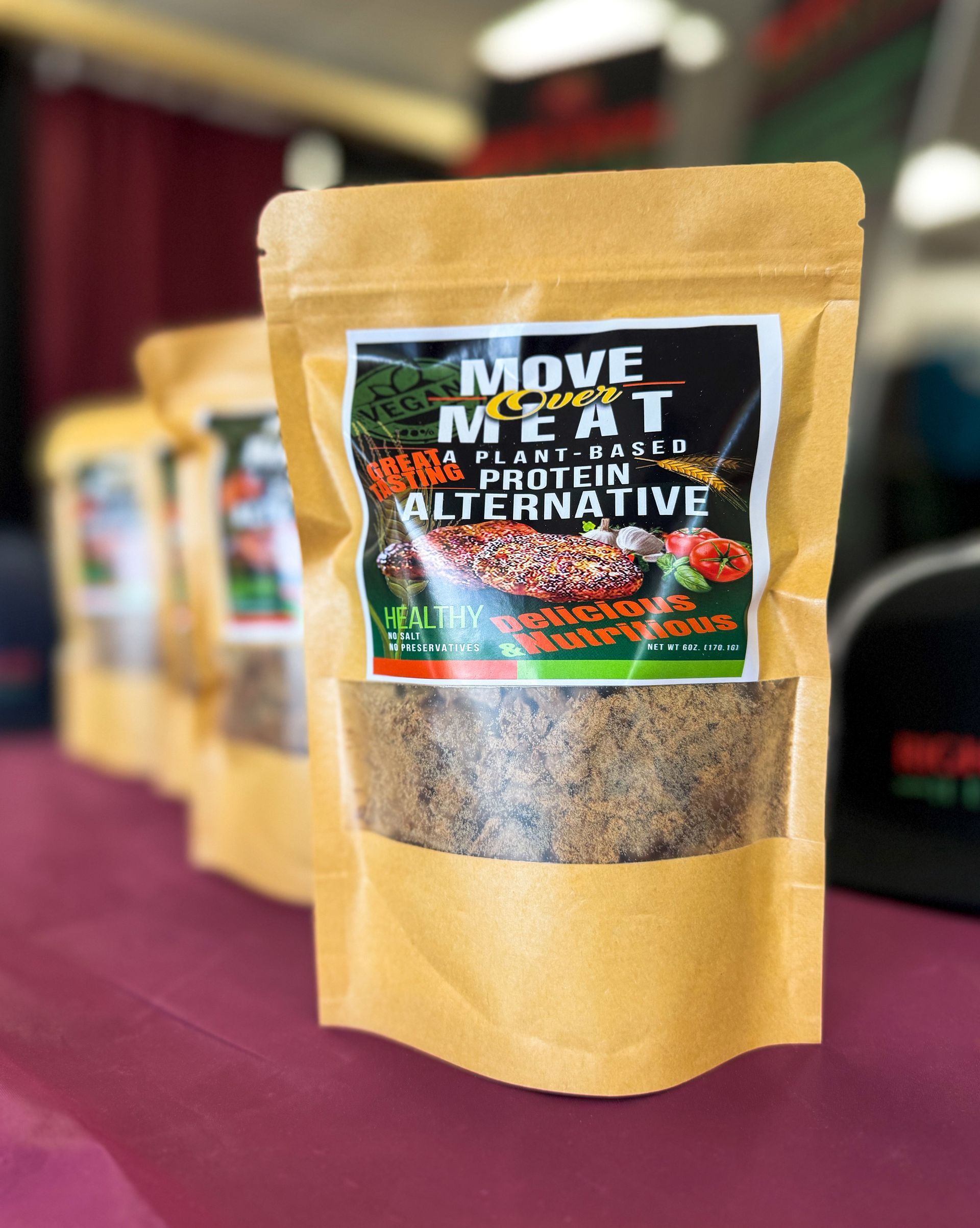 A bag of move meat alternative protein powder is sitting on a table.