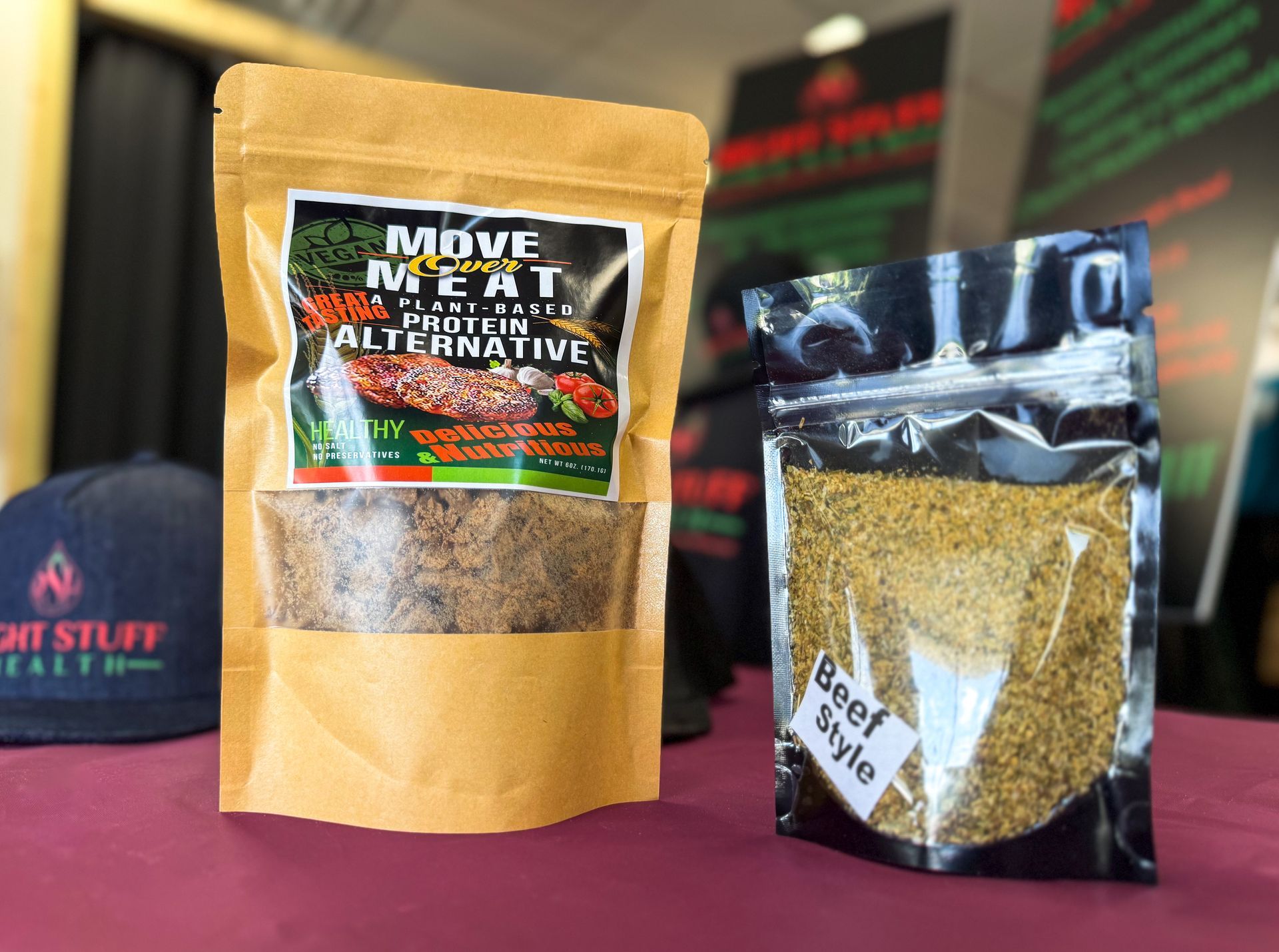 Two bags of food are sitting on a table next to each other.