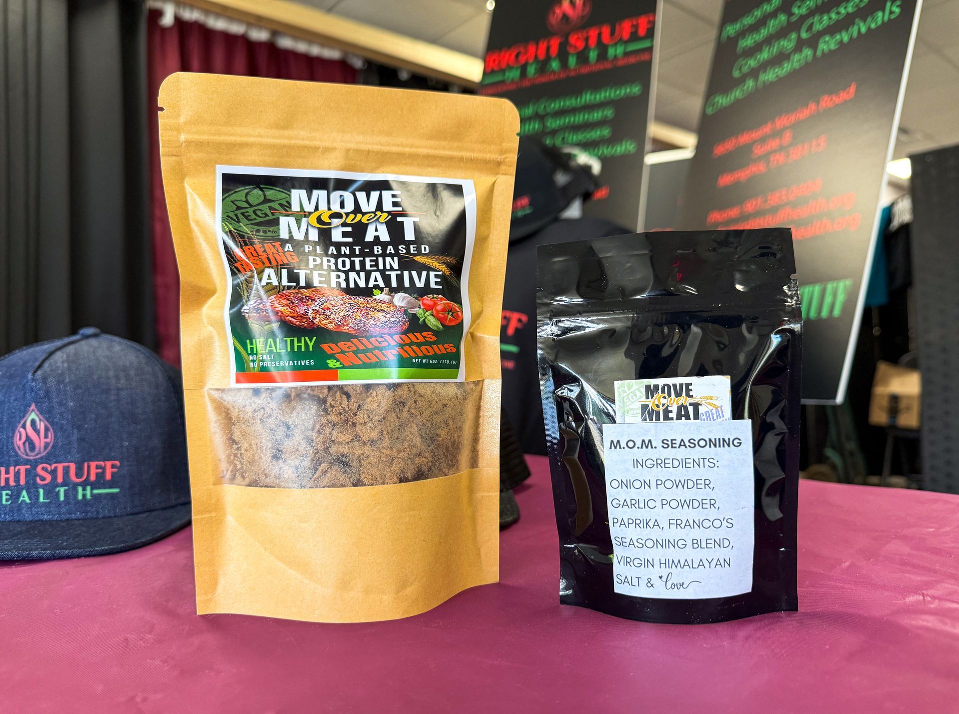 Two bags of food are sitting on a table next to each other.