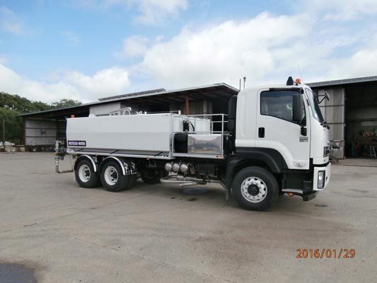 water truck in parking lot