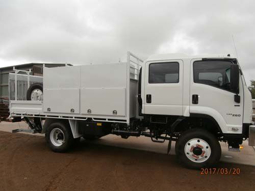 white workman truck with storage bins