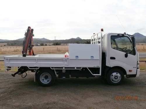 white workman truck with trailer bed