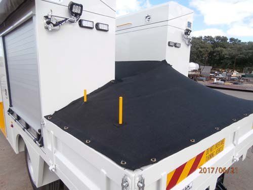 white workman truck with tarp