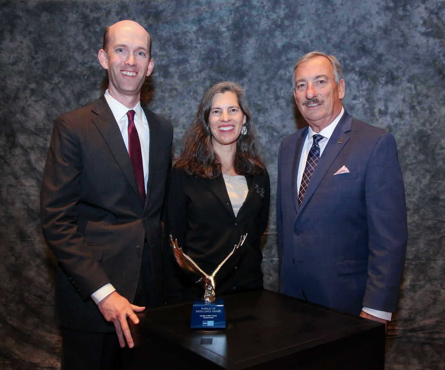 Owner Preston McKee and his wife, Shuly, accepting the Pursuit of Excellence Award