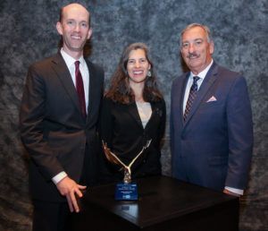 Owner Preston McKee and his wife, Shuly, accepting the Pursuit of Excellence Award