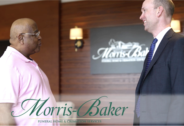 Owner of Morris-Baker Funeral Home & Cremation Services with family of loved one talking