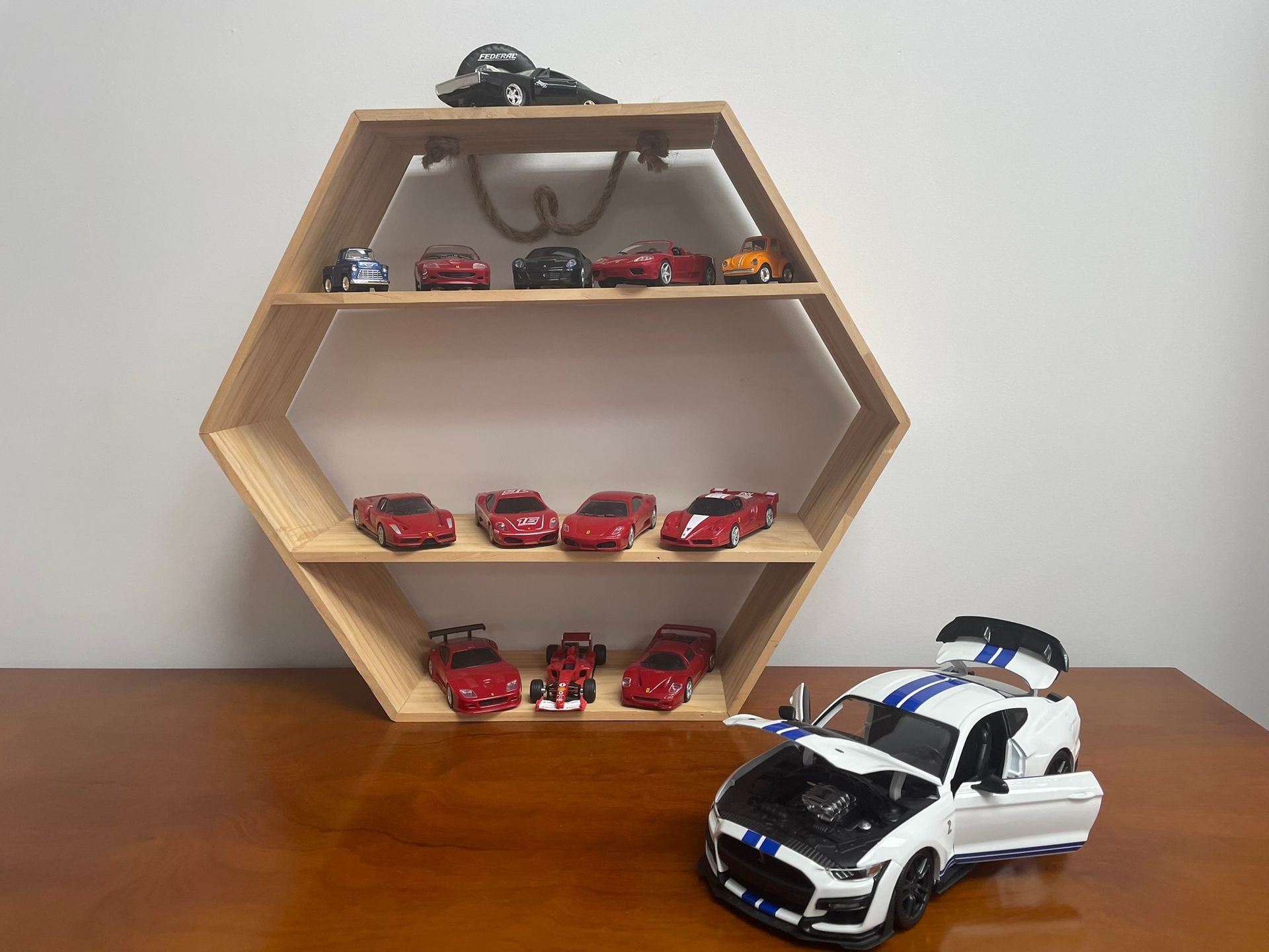 A shelf with model cars on it