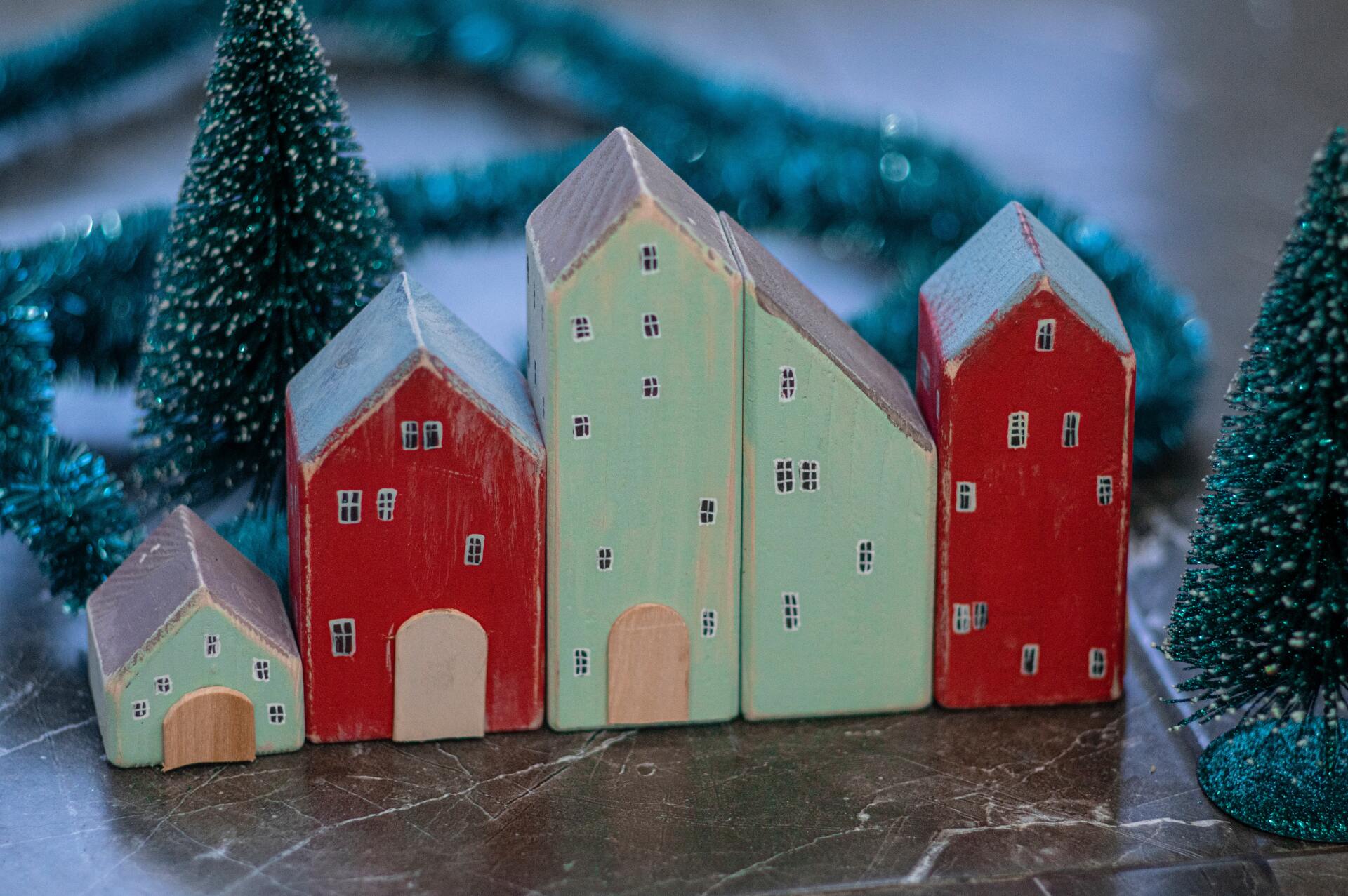 Red and mint green houses in a winter shop display