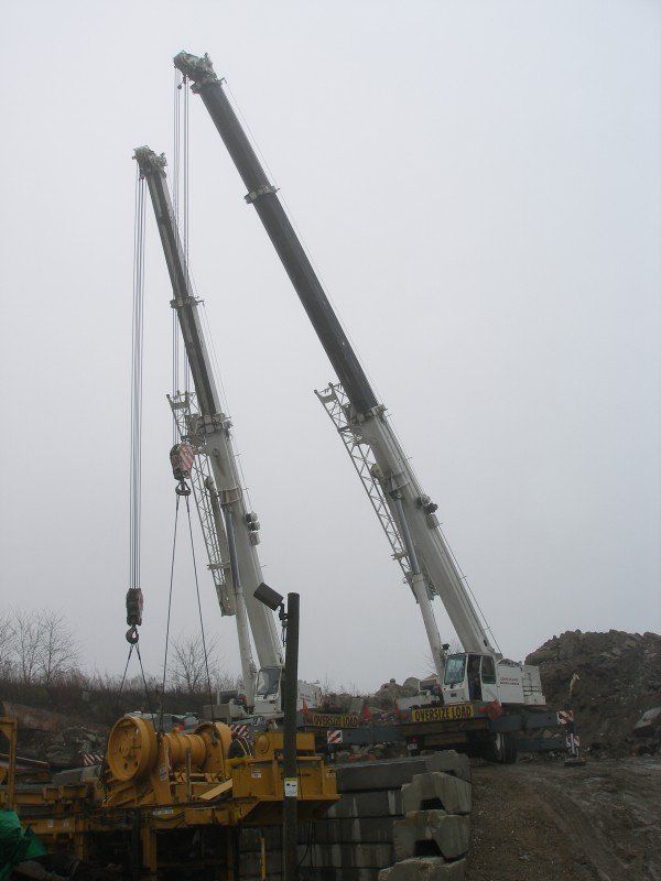 Two Cranes Disassembling A Concrete Crusher In Valley Stream