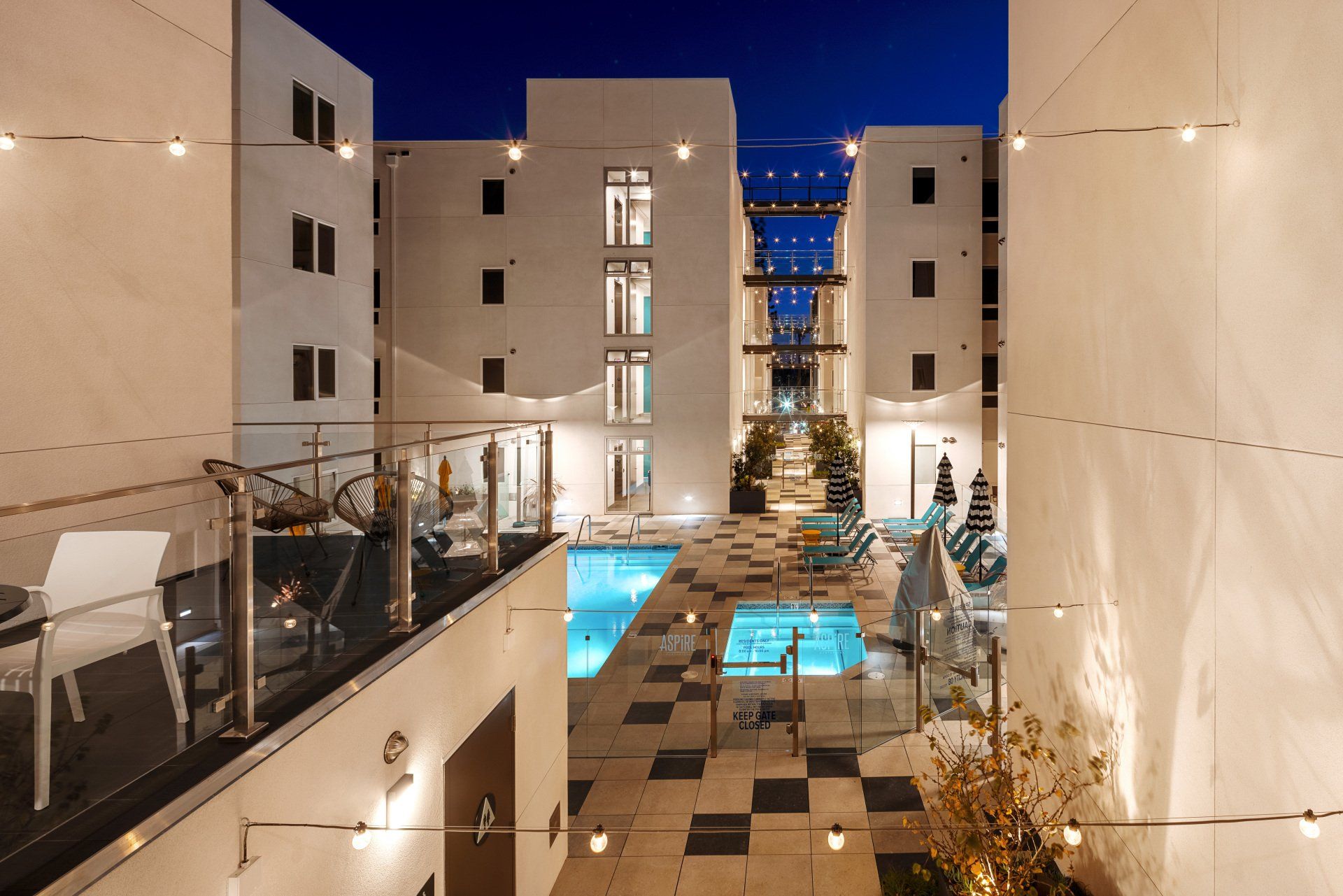 Aspire Apartment Complex Featuring Pool Photo At Night