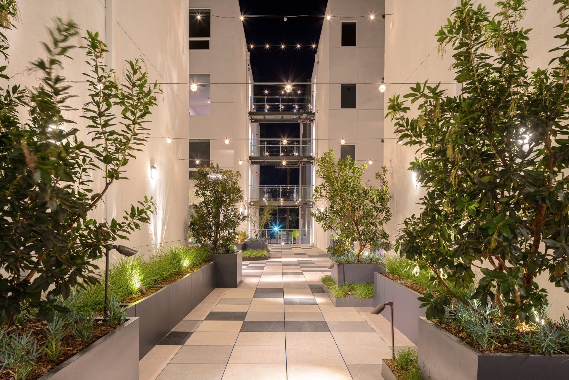 Aspire Apartment Complex Walkway Photo At Night