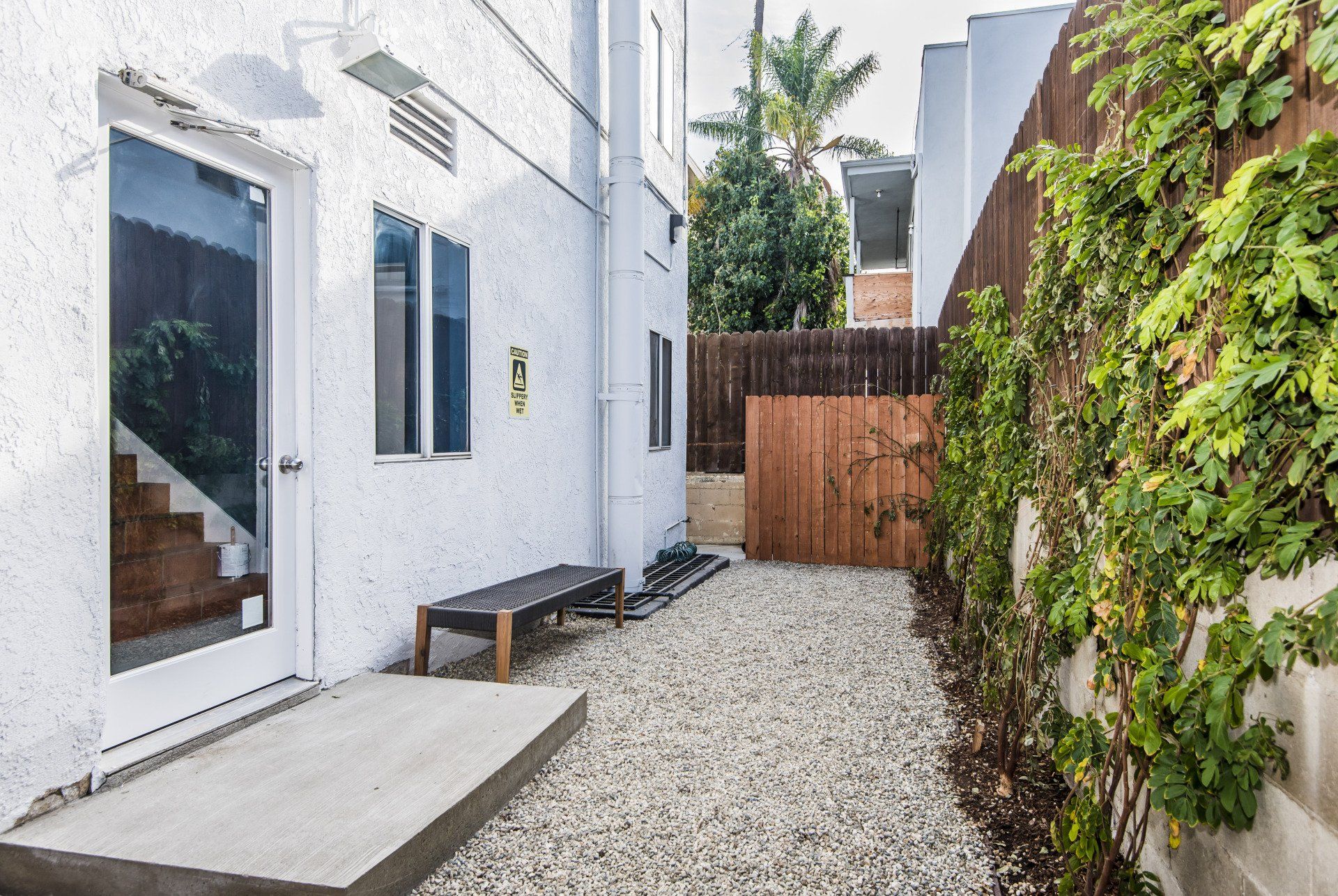 Curson Apartments Bath and Small Patio With Gravel Photo