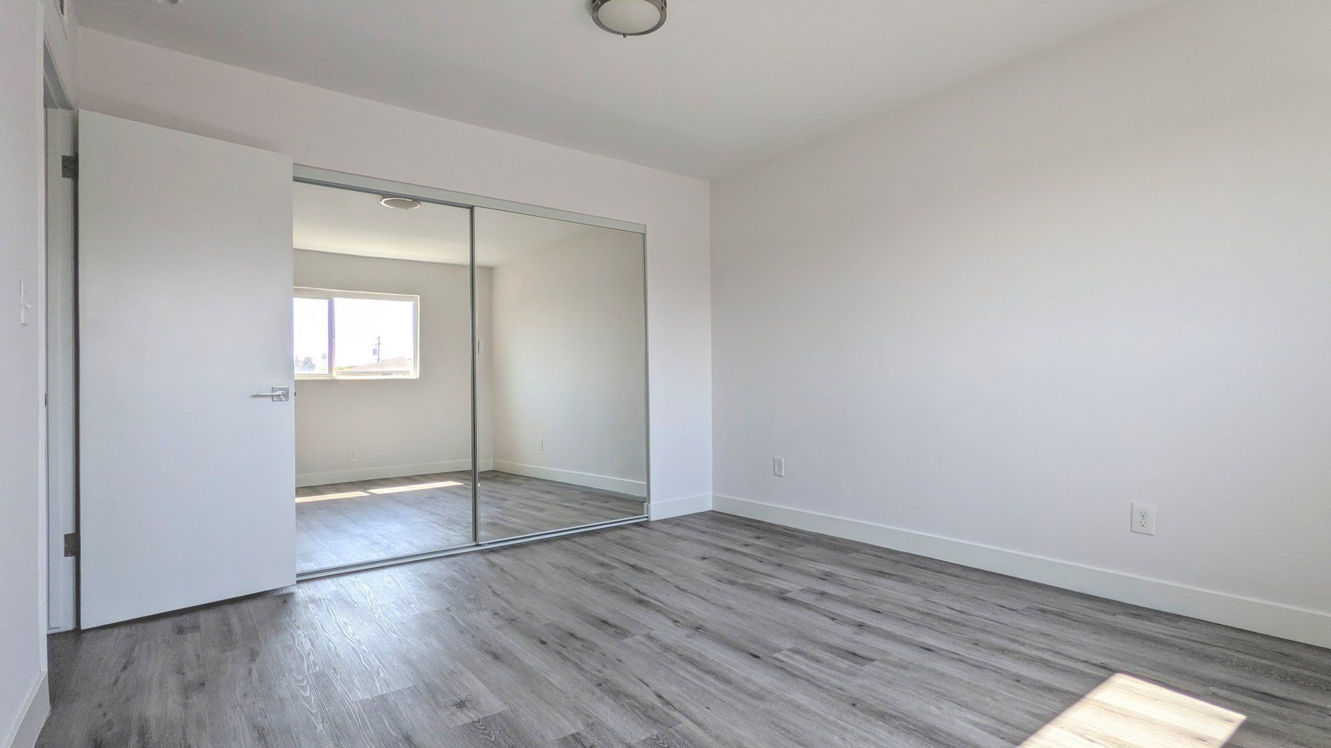 Market Street Bedroom Photo Showing Large Sliding Mirrored Doors For Closet