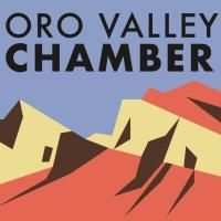 The logo for the oro valley chamber shows a mountain range.