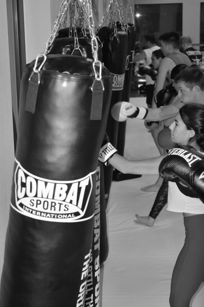 Kids with boxing gloves hit punching bags