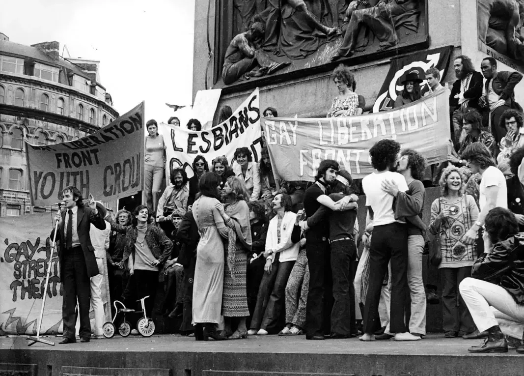 Historical image of people protesting in the 1969 Stonewall Riot.