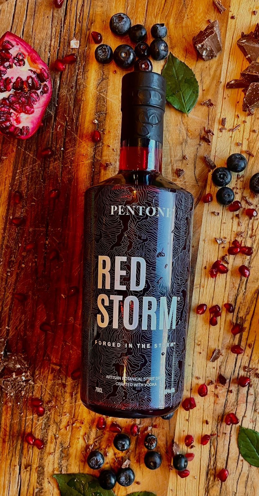 A bottle of red storm vodka with a natural cork top