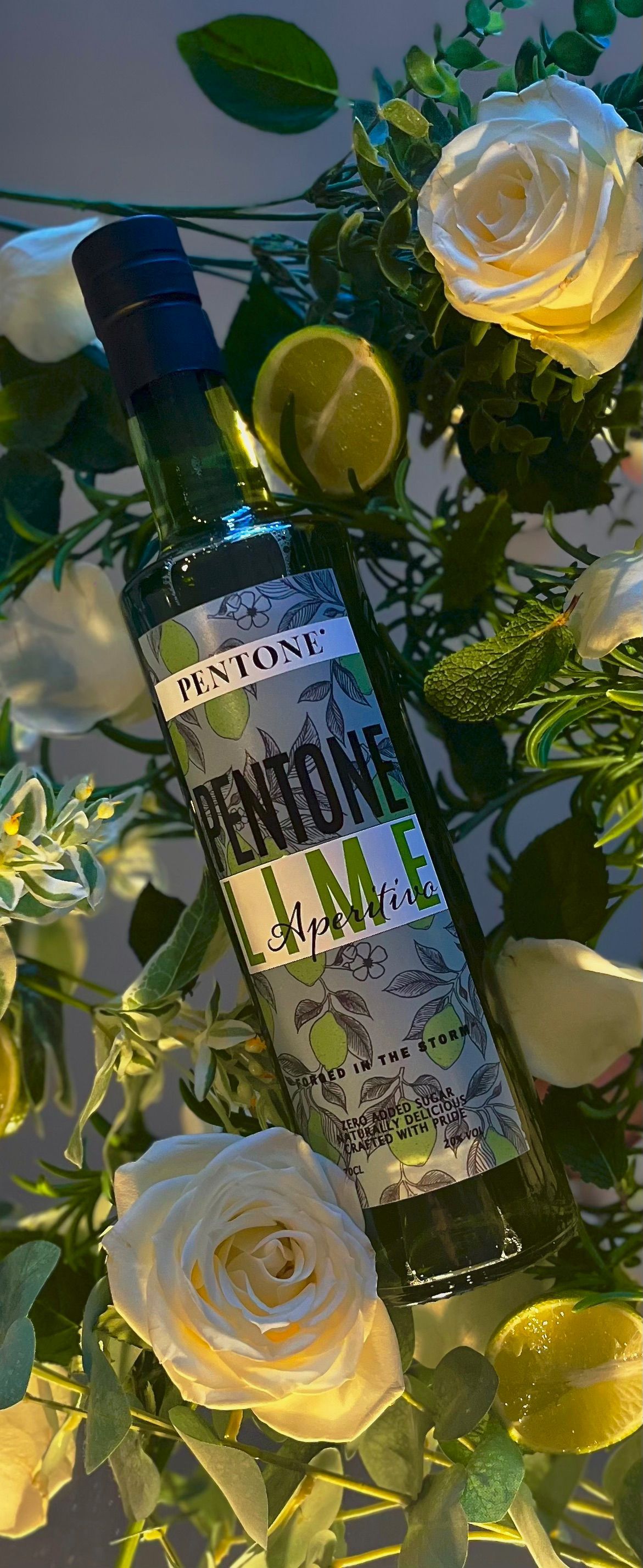 A bottle of pentone lime sits on a white surface