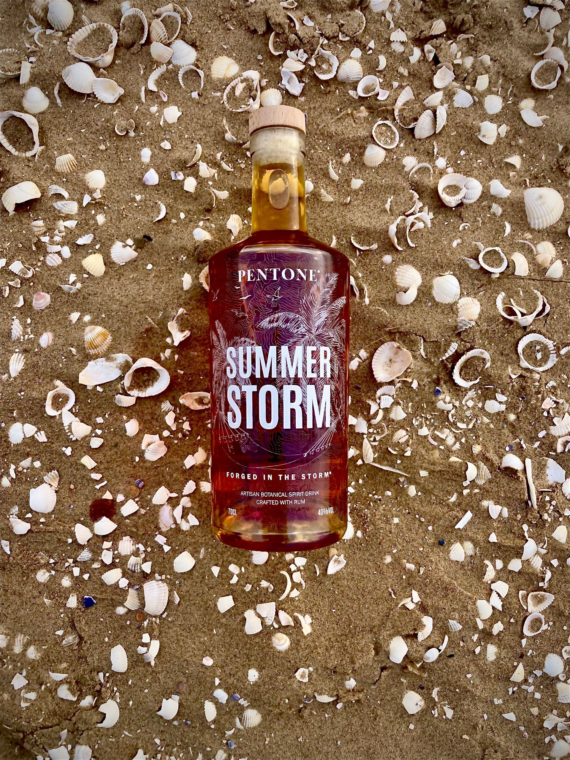 A bottle of pentone summer storm rum on a white background.